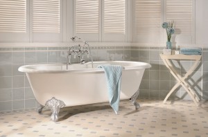 Freestanding white tub with tasteful tile