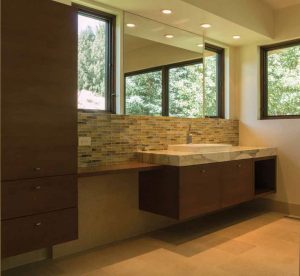  This Five Star Kitchen and Bath bathroom merges rustic and contemporary for a modern mountain look; clean, white cabinetry and grey accents are a winning combination.