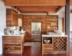 This “Ski Chalet” designed by Hunter & Company Interior Design and built by Bear Mountain Builders features cabinets by The Old World Cabinet Company. The horizontal linearity of the cabinets is a nod to modern sensibilities, while the liberal use of wood in the kitchen offers echoes of traditional ski chalets.